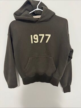 Essentials 1977 Graphic Hoodie - Olive Green Men’s Sweatshirt